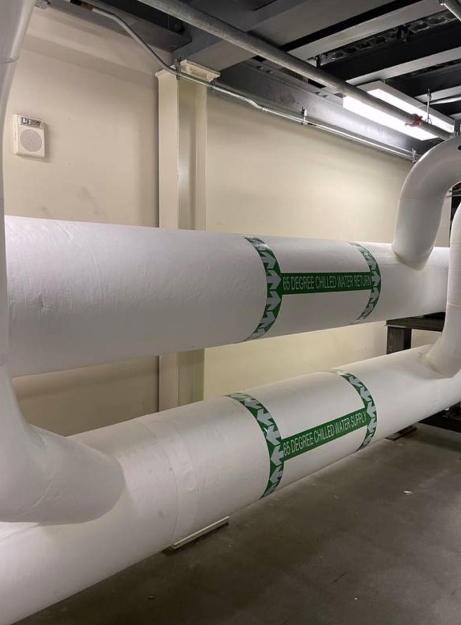 Large pipes carrying water through the NWSC cooling loop